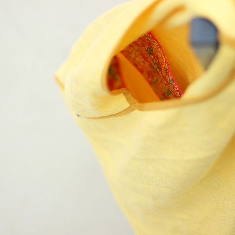 interior bolso tela amarillo